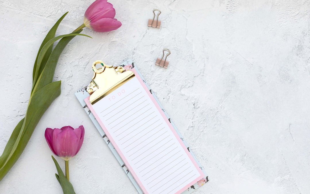 Pink tulips, to do list and paper clips