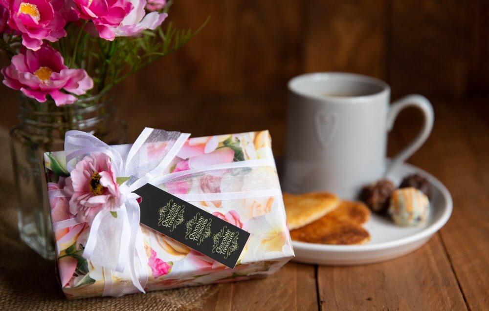 product photography - box of chocolates with a mug of coffee 