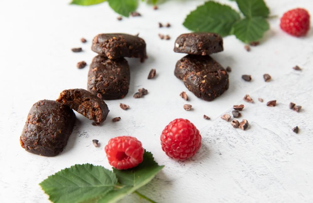 Food photopgraphy - chocolate health bars with raspberries.