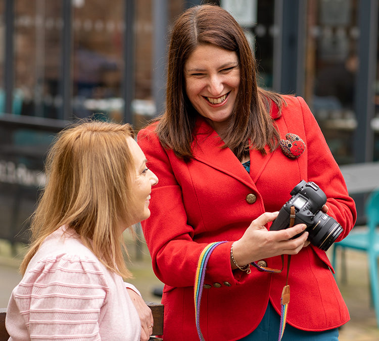 Woman Photographer showing her female client the photos