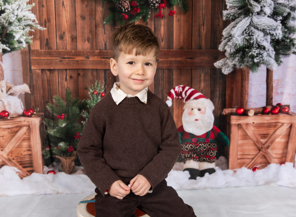 Family on Christmas backdrop for a photoshoot