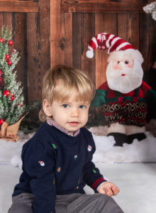 Family on Christmas backdrop for a photoshoot