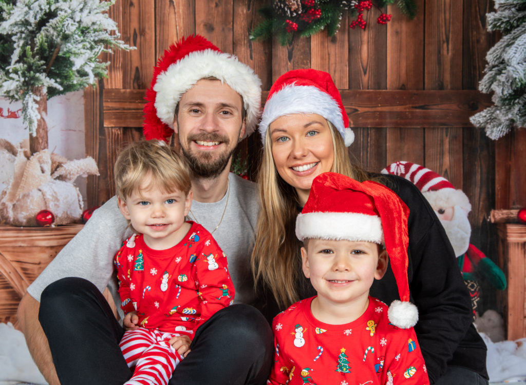 Family on Christmas backdrop for a photoshoot