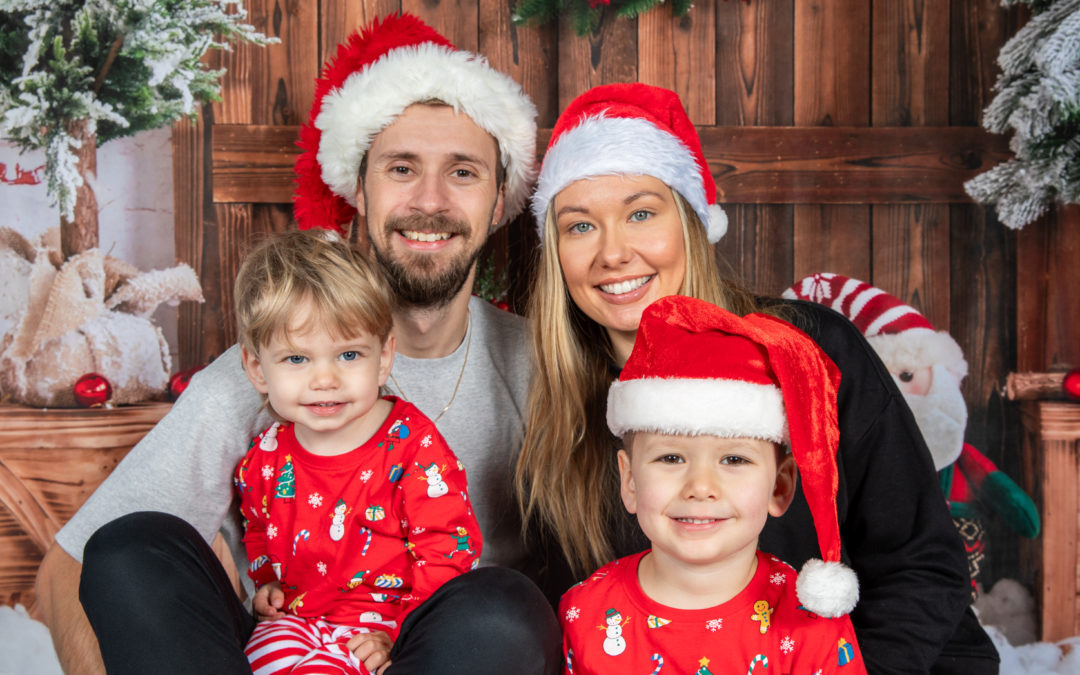 Family on Christmas backdrop for a photoshoot