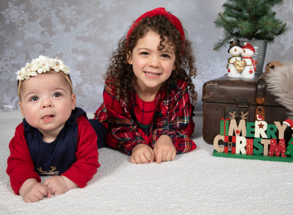 Family on Christmas backdrop for a photoshoot